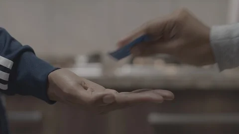 Patient hands over condom Stock Footage