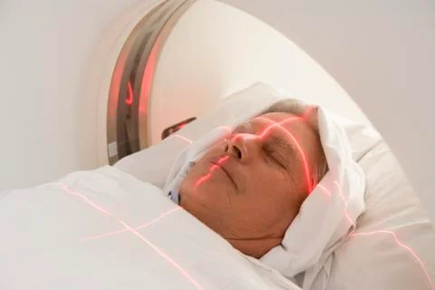 Patient Having A Computerized Axial Tomography (CAT) Scan Stock Photos