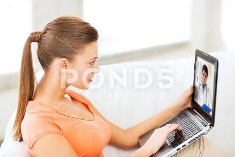 Patient having video chat with doctor on laptop Stock Photos