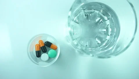 Patient in the hospital takes medicine with water, close-up, view from the to Stock Footage
