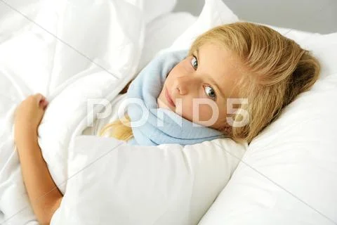 Patient with influenza lying on the bed Stock Photos
