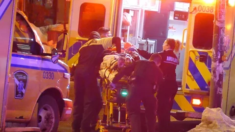 Patient loading patient with CPR in progress Stock Footage 125472893