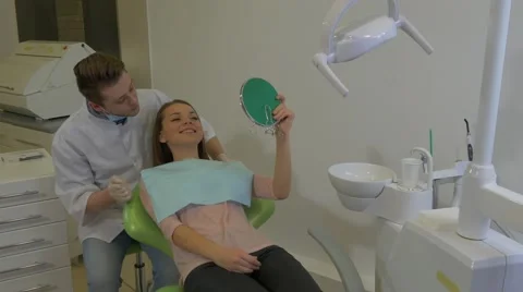 Patient is Looking at Mirror Dentist is Talking Takes a Mirror Young Male Stock Footage 60975147