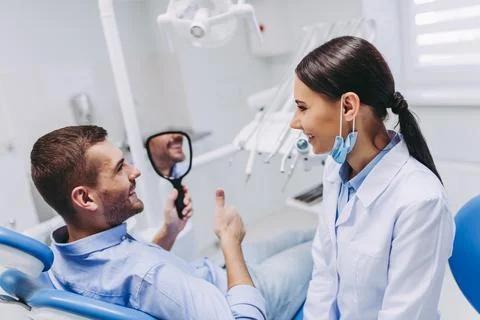 Patient looking in the mirror Stock Photos