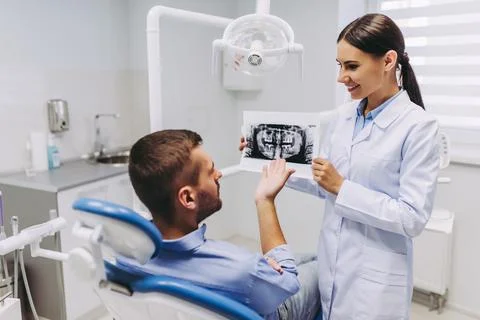 Patient looking at x-ray Stock Photos