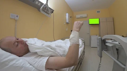 Patient lying in bed puts on glasses and sends a message Stock Footage 127292130