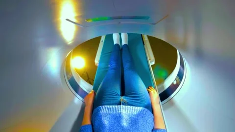 Patient lying inside an mri scanner for a medical diagnostic procedure Stock Footage 340356031