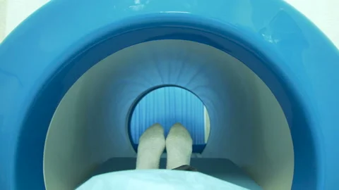 A patient moving into mri scan machine Stock Footage