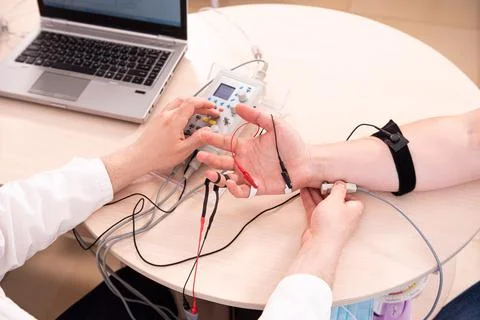 Patient nerves testing using electromyography at medical center Stock Photos