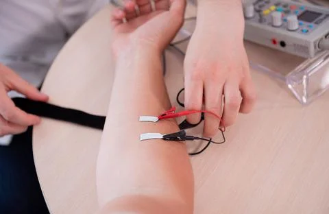 Patient nerves testing using electromyography at medical center Stock Photos