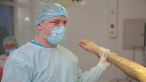Patient on the operating table. nurses prepare the patient for surgery. Stock-Footage 135309736