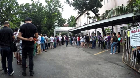 Patient patients long queue outside hospital Stock Footage 68300905