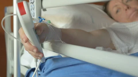 Patient press red emergency button to call nurse for help in hospital Video stock 112674589