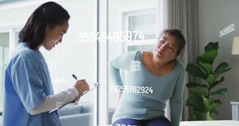 Patient pressing back and grimacing triggers caregiver checking pain with Video stock 328495686