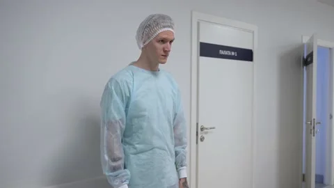Patient is put on a lab coat before laser vision correction surgery in clinic 스톡 동영상 159469113