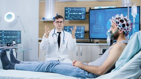 Patient sitting on a bed in a facility for brain research Video stock 119766021