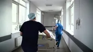 Patient On Stretcher Pushed At Speed Through A Hospital Corridor By Doctors Stock Footage