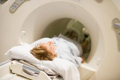 Patient undergoing for a computerized axial tomography (cat) scan Stock Photos