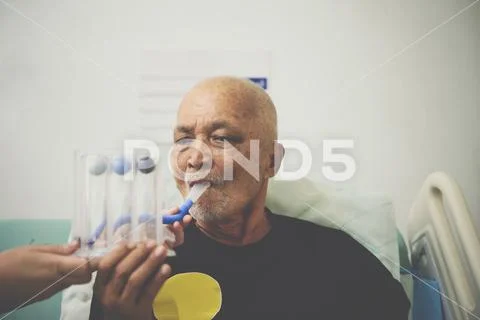 Patient use Incentive Spirometer in hospital Stock Photos