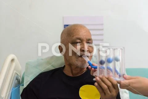 Patient use Incentive Spirometer in hospital Stock Photos