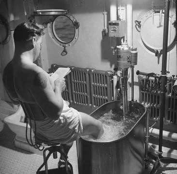 Patient using a whirlpool bath as part of hydrotherapy aboard the American hospi Stock Photos