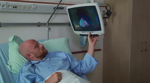 Patient is watching TV in hospital room Stock Footage