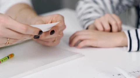 Patient at worktable. Close up young female doctor writing notes in Stock-Footage 336588374