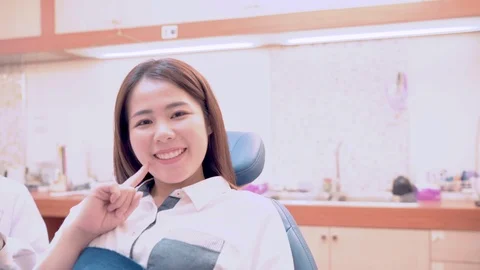 Patients and dentists looking at camera smile Stock Footage 117513862