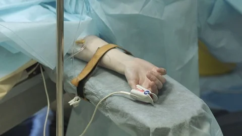 The patient's hand on the operating table Stock Footage 72969713