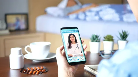 Patient's relatives making online consultation with doctor on mobile application Stock Footage 166998570