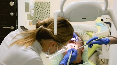 The patient's teeth are drilled Stock Footage 112532963