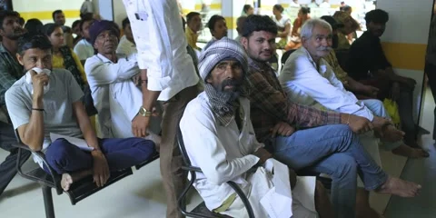 Patients wait doctor. Queue patient sit in hospital waiting room Stock Footage 238522426