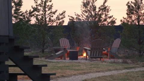 Patio and fire in the fire pit in the evening. Pleasant summer evening. A 스톡 동영상 245992889