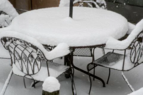 Patio Furniture Blanketed by the Snow Stock Photos