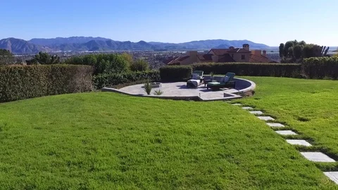 Patio overlooking mountain view and city aerial Stock Footage 86253349