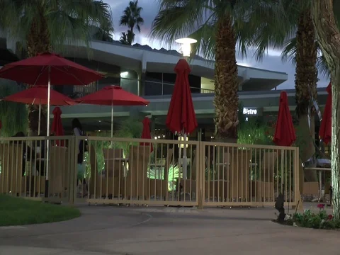 Patio with Red Umberellas in Evening 스톡 동영상 82308913