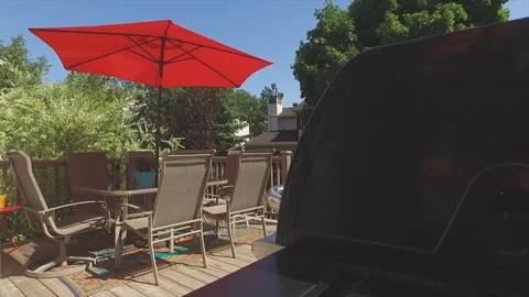 Patio set revealed from behind bbq Vidéo 103348790