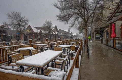 Patio Tables in a Spring Snowfall 스톡 사진