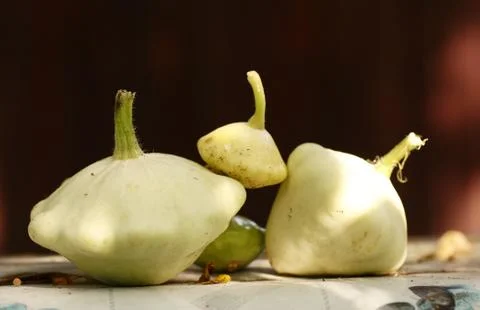 Patisson bush pumpkin lay on table outdoor still life Stock Photos