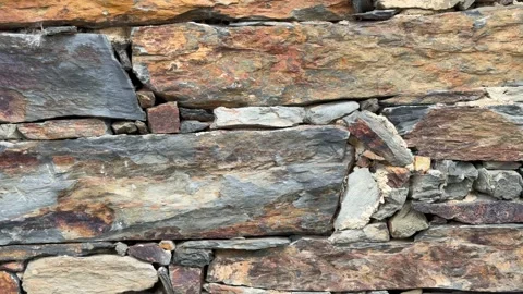 Patones close-up video of a rustic stone wall background Stock Footage 346989981