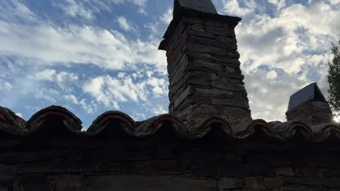 Patones old rustic stone chimney and mossy roof tiles in patones de arriba Video stock 346989999