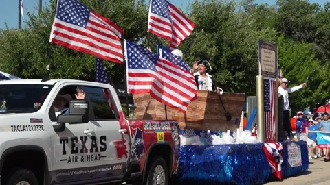 Patriotic parade float with American flags and people waving Video stock 340940914