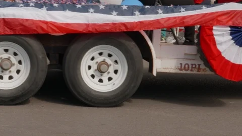 Patriotic Parade Float Driving Down the Road Stock Footage 98520973
