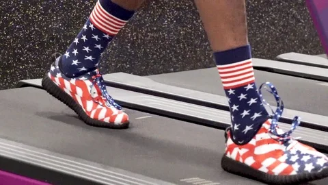 A patriotic walk on the treadmill Stock Footage 124836583
