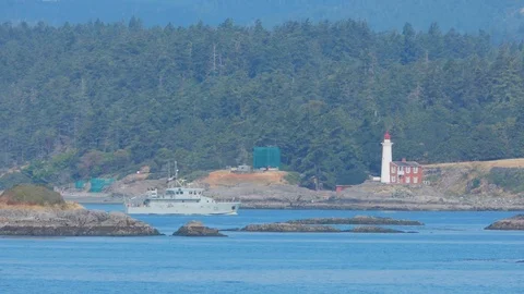 Patrol Ship Passing Lighthouse Stock Footage 91624888