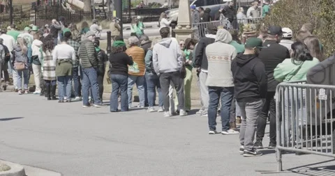 Patrons cue up in long line to enter beer festival Stock Footage 240490936