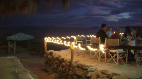 Patrons dine at an outdoor beach restaurant. Stock Footage
