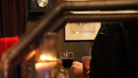 Patrons drinking wine at bar Stock Footage 2206084