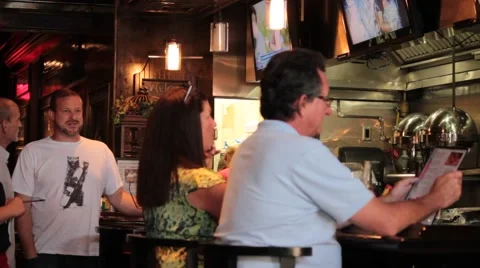 Patrons at restaurant bar Stock Footage 40538902
