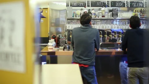 Patrons Standing at Craft Beer Bar Counter Handheld Slow Motion Shot Stock Footage 346523224